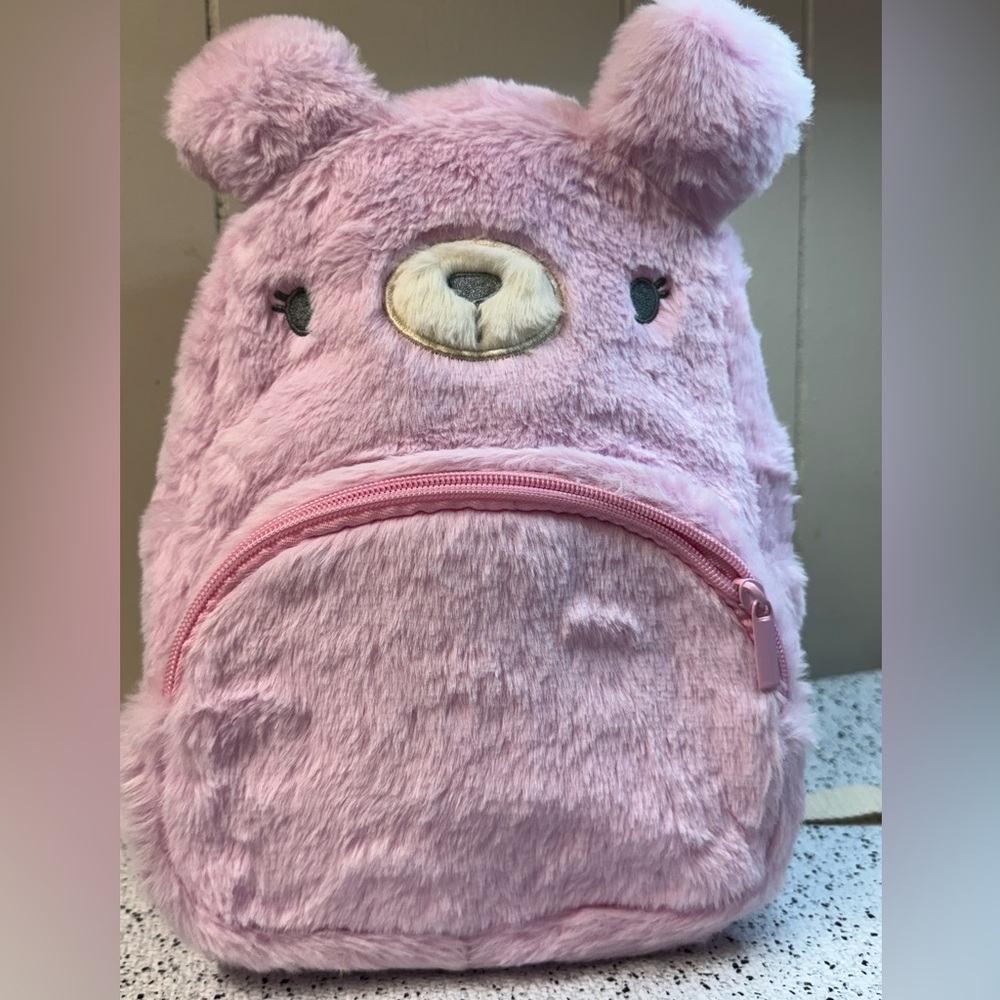 Claire’s pink fluffy backpack